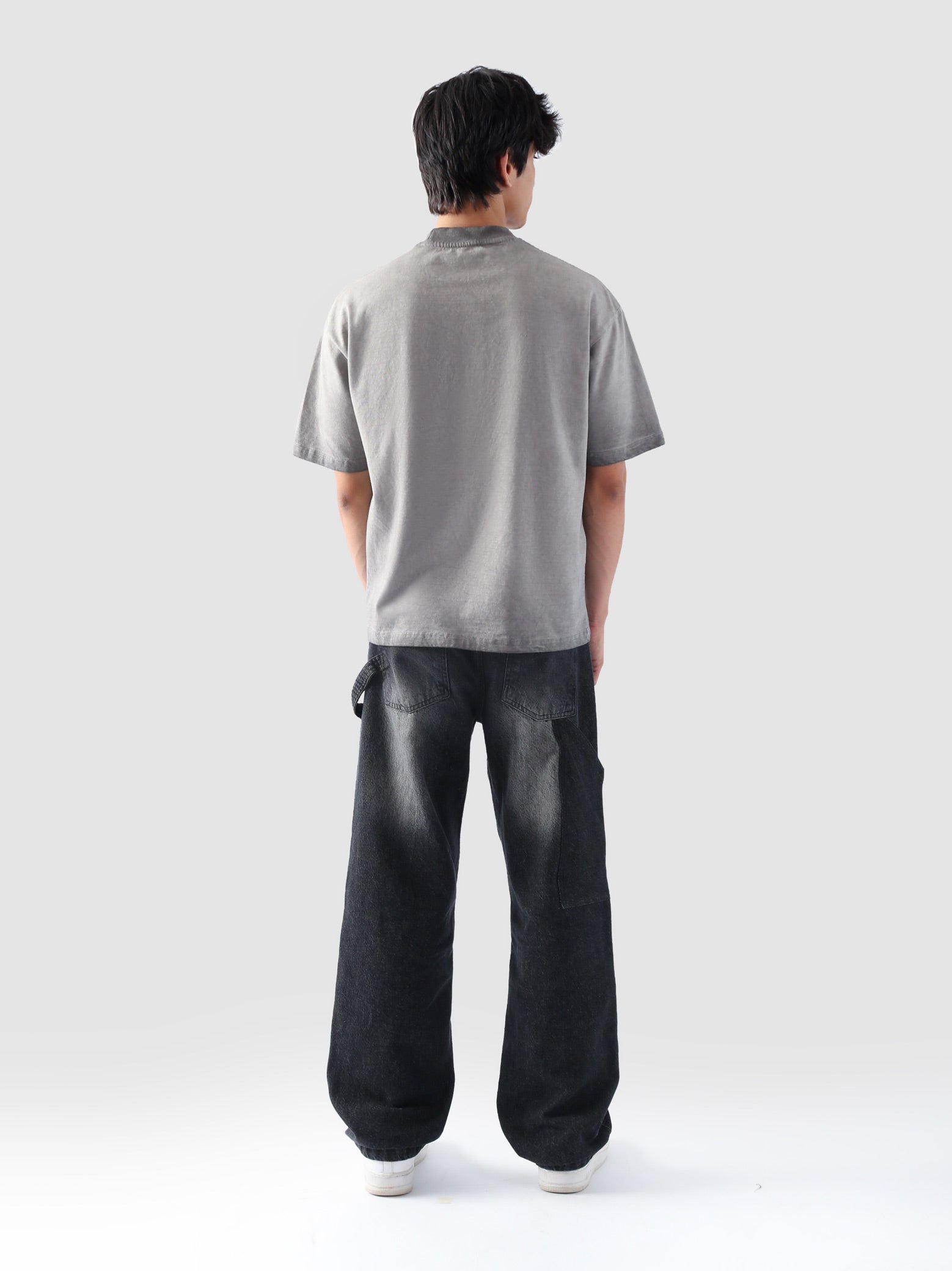 Rear view of the Oil Fade Blank t-shirt showcasing its clean silhouette and seamless gradient fade from stone grey to charcoal.

