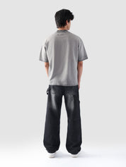 Rear view of the Oil Fade Blank t-shirt showcasing its clean silhouette and seamless gradient fade from stone grey to charcoal.
