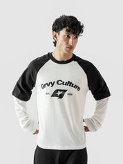 Person wearing a black and white 'Grvy Culture' long-sleeve shirt on a light gray background