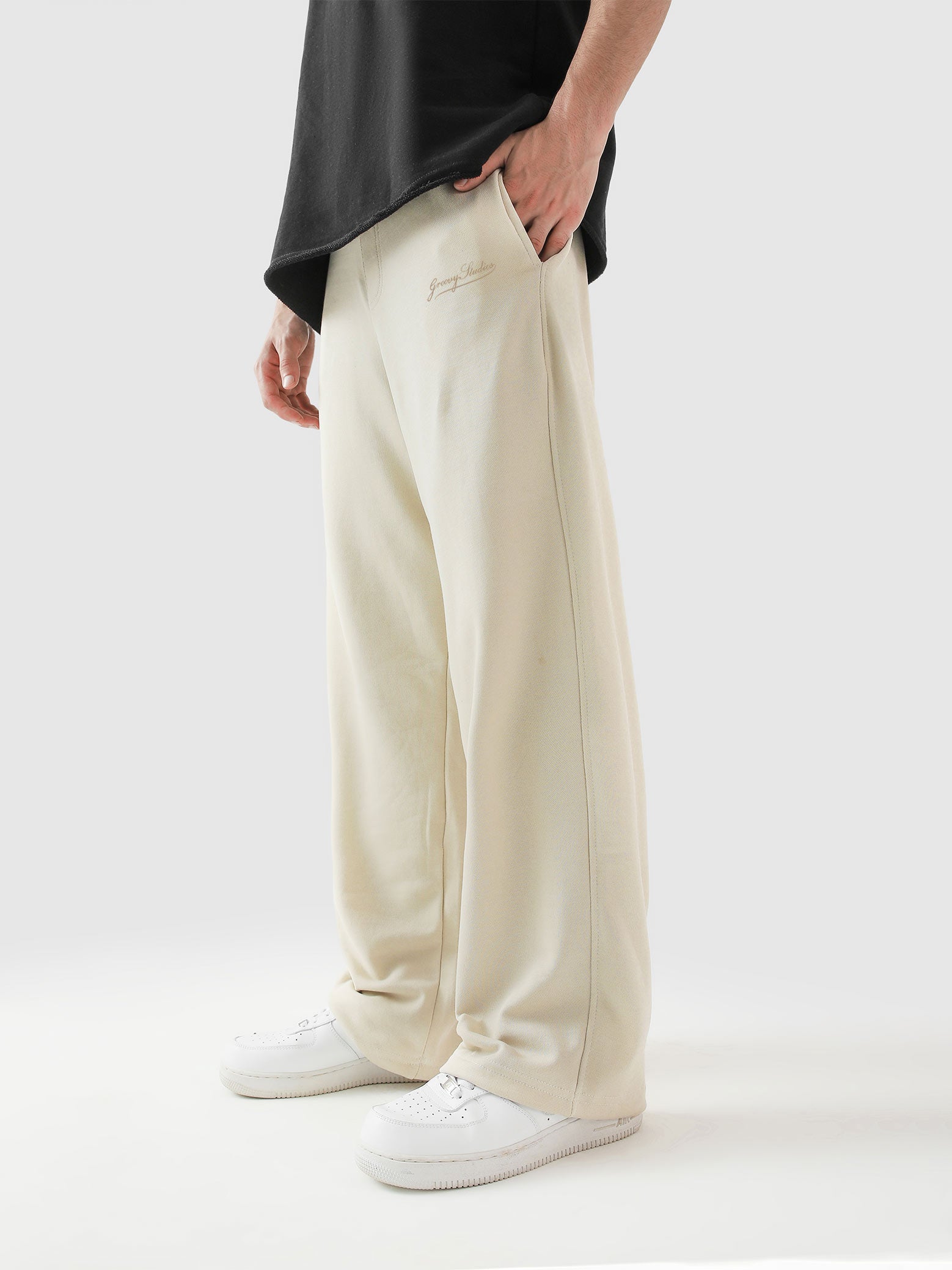 Cream baggy trousers full body front shot male model Pakistan – GROOVY