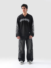 Front view of GROOVY's Chrome Hearts-inspired full sleeves jersey in gothic black with bold arm prints.