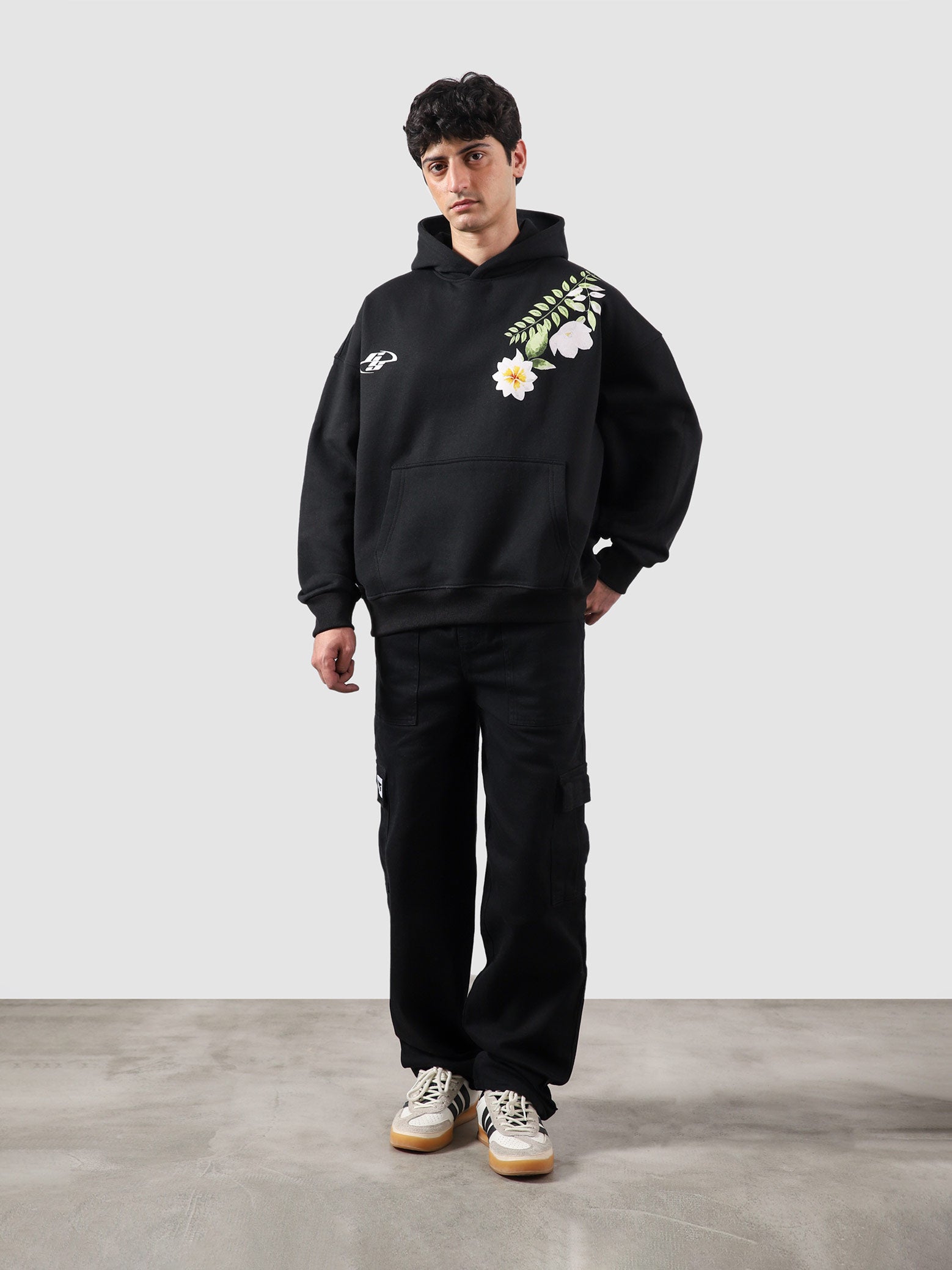 Floral hoodie male model full body front view bold floral graphic Pakistan – GROOVY