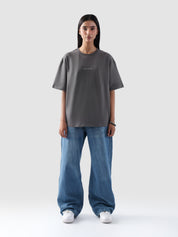Woman wearing grey oversized t-shirt with 'Zero to One' print – unisex streetwear in Pakistan by Groovy