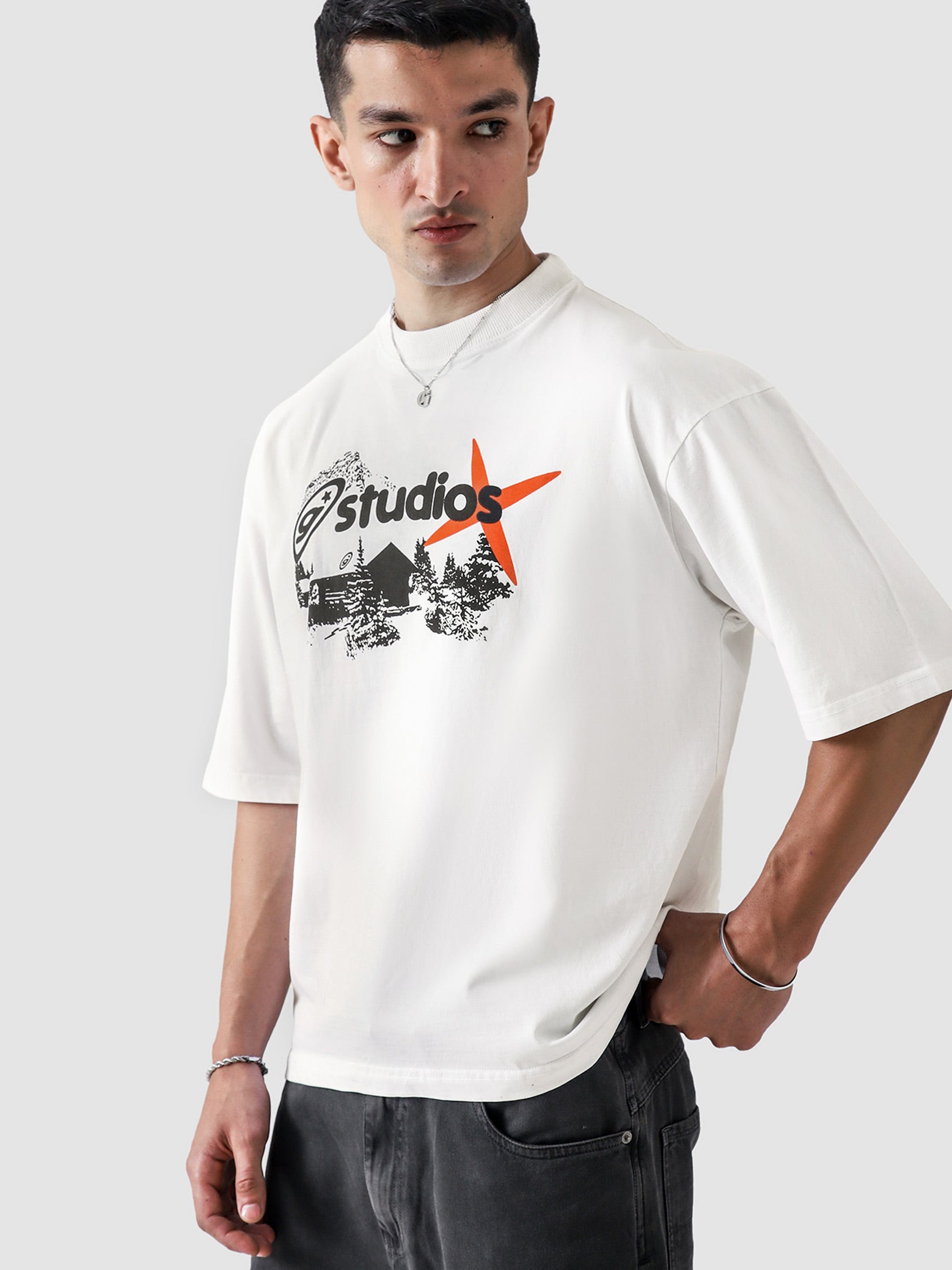White Oversized Graphic Tee Male Model Back View – GROOVY Studios – GROOVY Pakistan