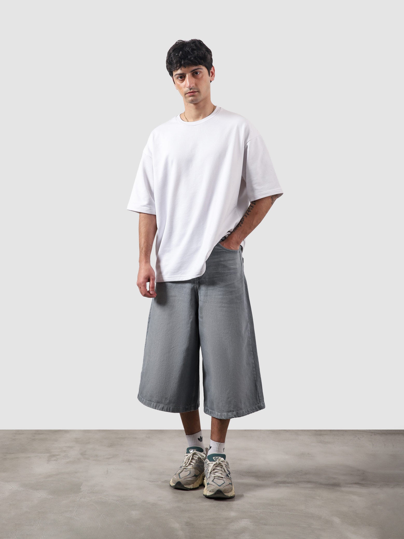 Jorts dark stone male model full body front view oversized denim shorts Pakistan – GROOVY