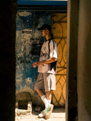 Man wearing GROOVY Aim oversized basketball jersey, mesh streetwear top, Pakistan
