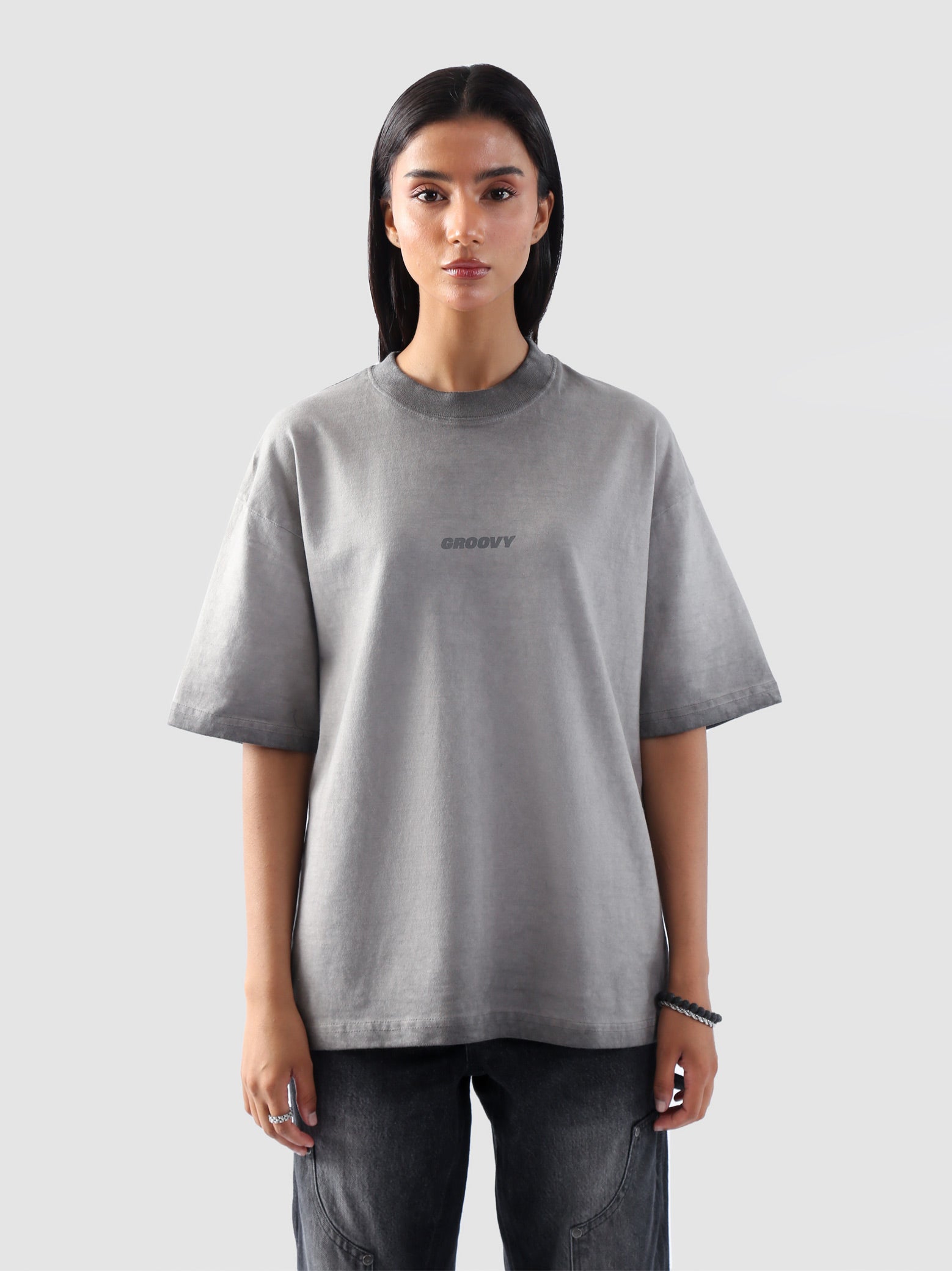 Close-up front view of the Oil Fade Blank t-shirt highlighting its unique gradient wash and minimal “GROOVY” chest print.
