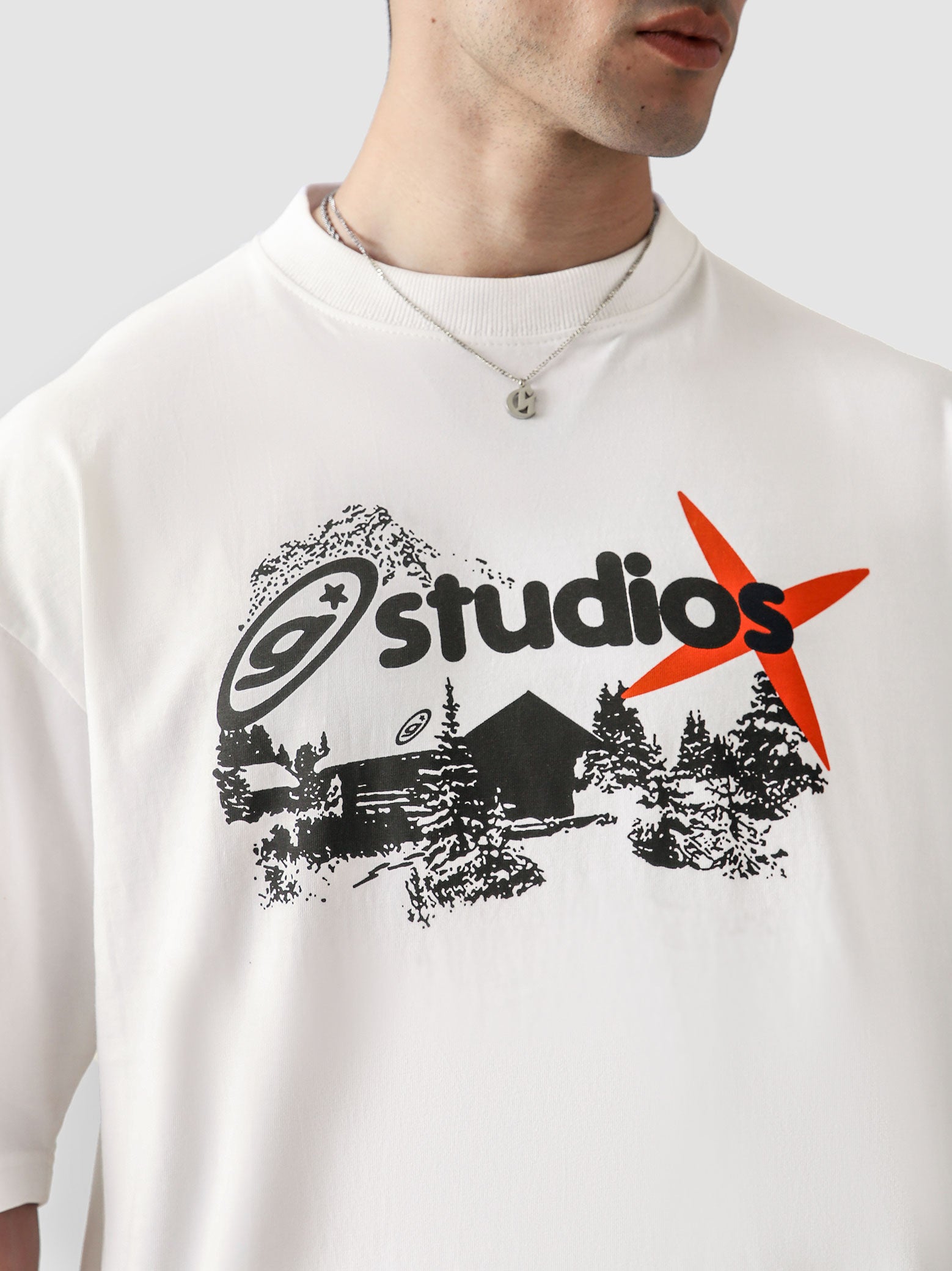 White Oversized Graphic Tee Male Model Front View – GROOVY Studios – GROOVY Pakistan