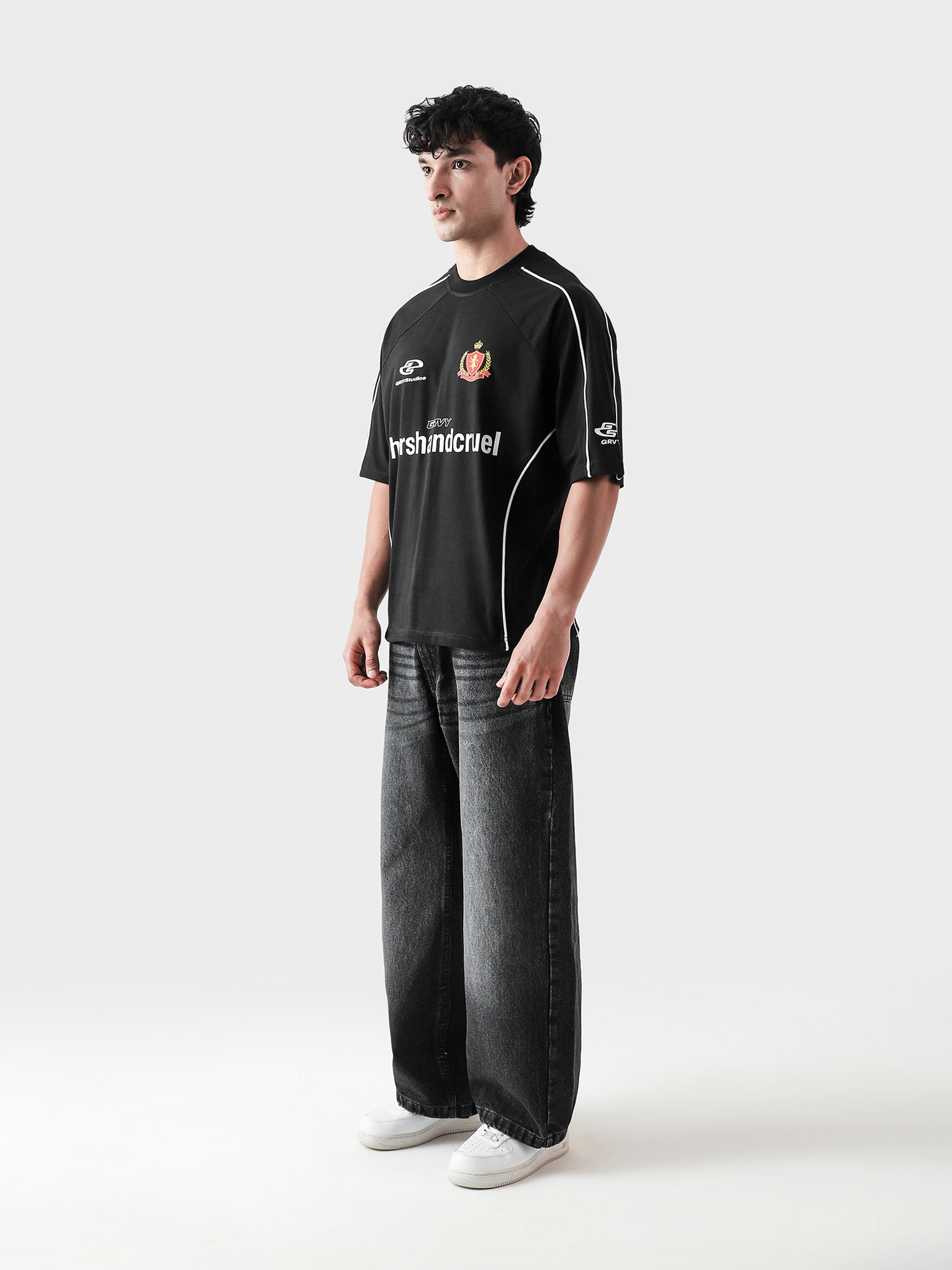 HARSH and CRUEL #7 black jersey male model side angle oversized streetwear Pakistan – GROOVY