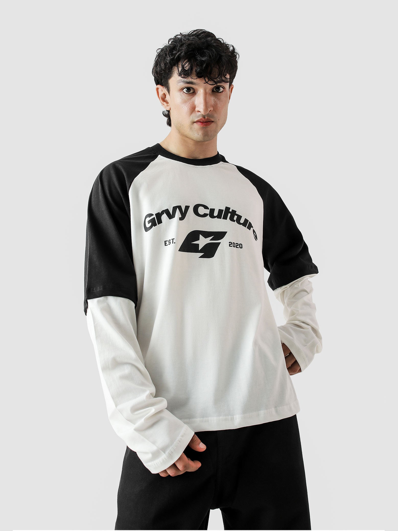 Person wearing a black and white long-sleeve shirt with 'Gryv Culture' logo on a light gray background