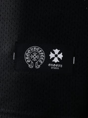 Detailed view of GROOVY's Chrome Hearts-inspired logo label on the black mesh fabric.