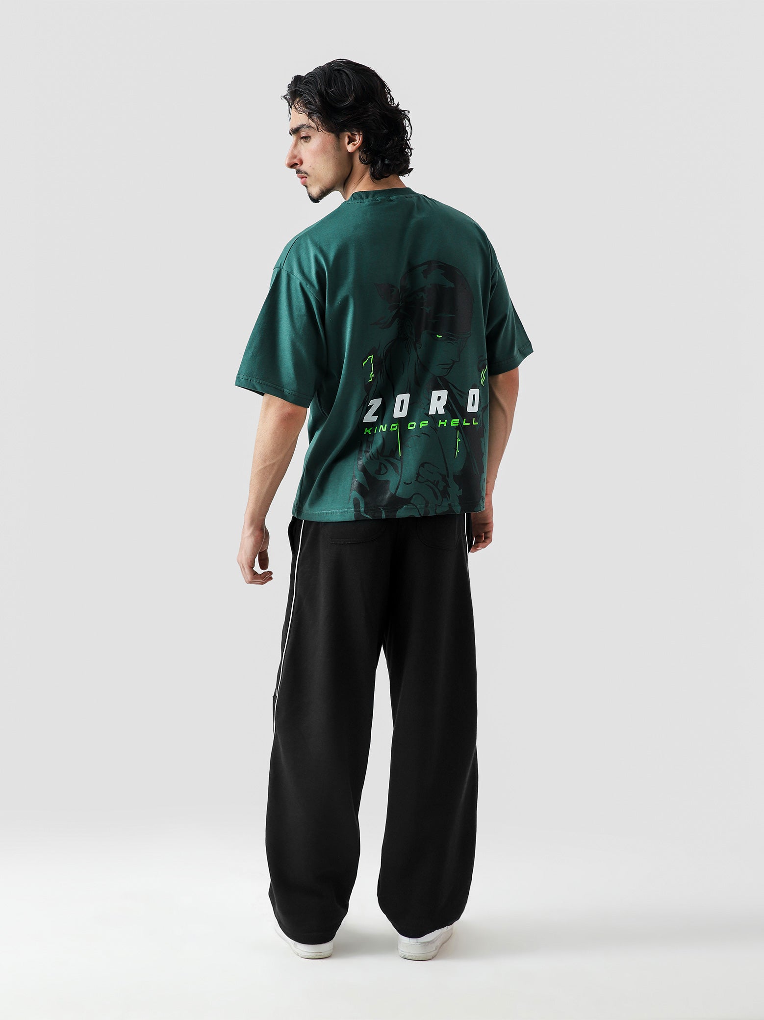 ZORO One Piece tee couple lifestyle shot racing green streetwear Pakistan – GROOVY