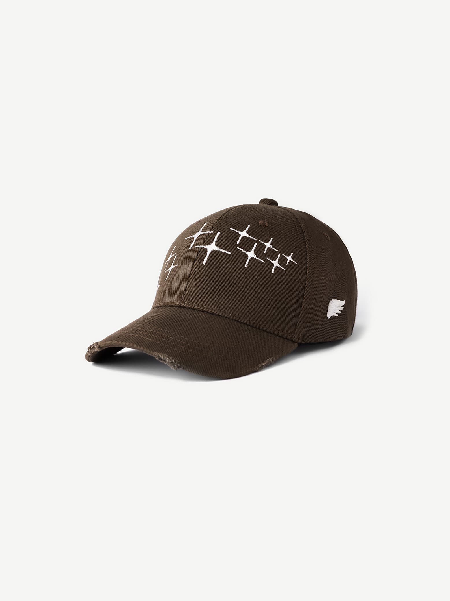 Brown cap with white patterns on a white background