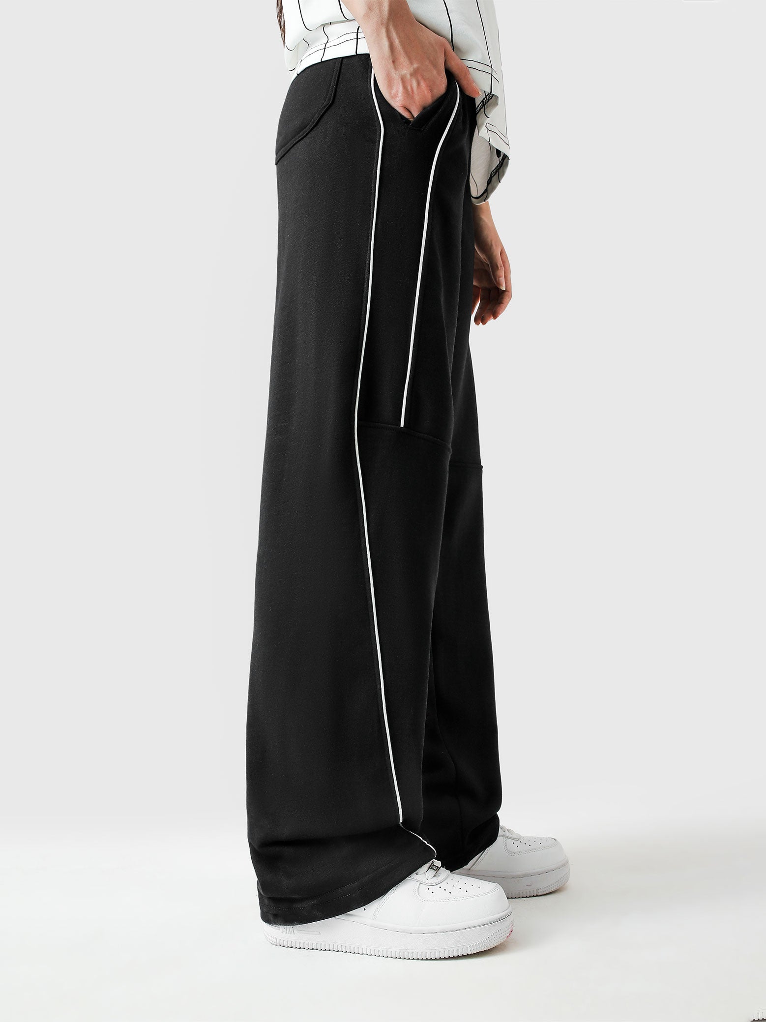 Black piping trouser couple lifestyle shot streetwear Pakistan – GROOVY