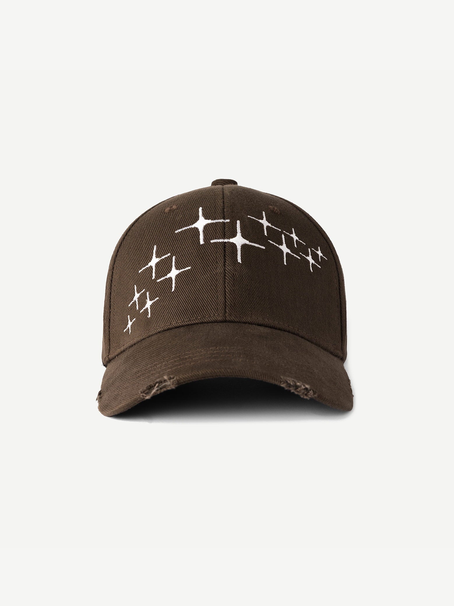 Brown cap with white star patterns on a light gray background