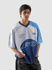 Man wearing oversized blue and white sublimation jersey with racing-inspired graphics – streetwear top by Groovy Culture Pakistan
