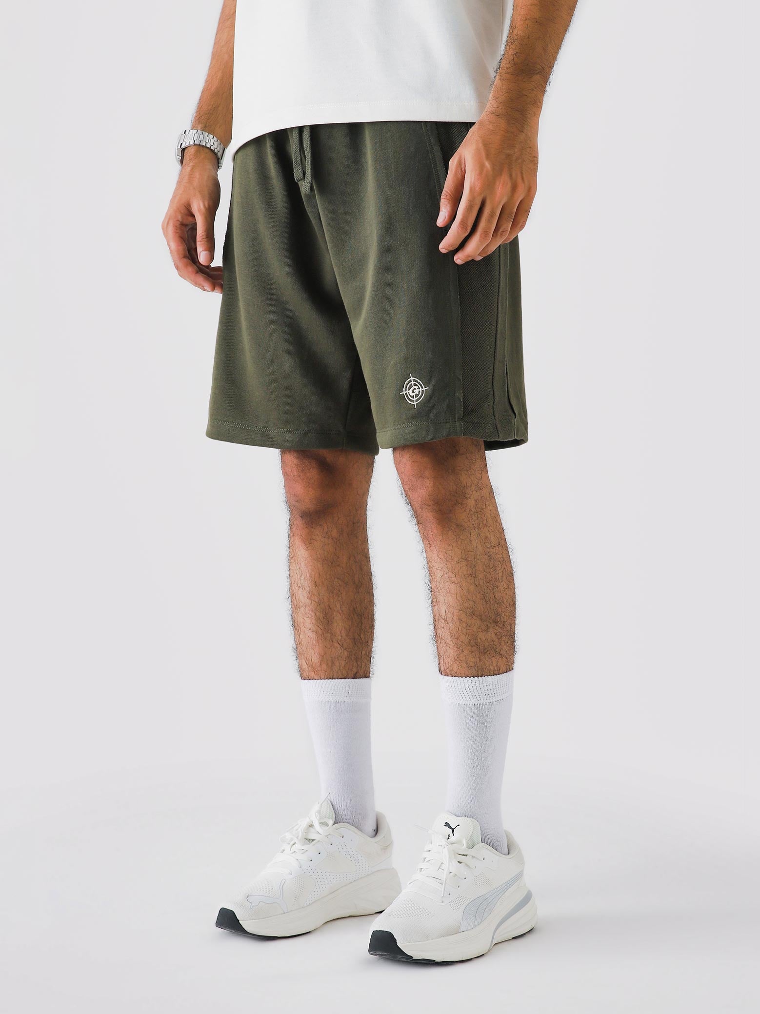 Man wearing Military Green Aim Shorts, GROOVY men's sport and lounge shorts, Pakistan streetwear
