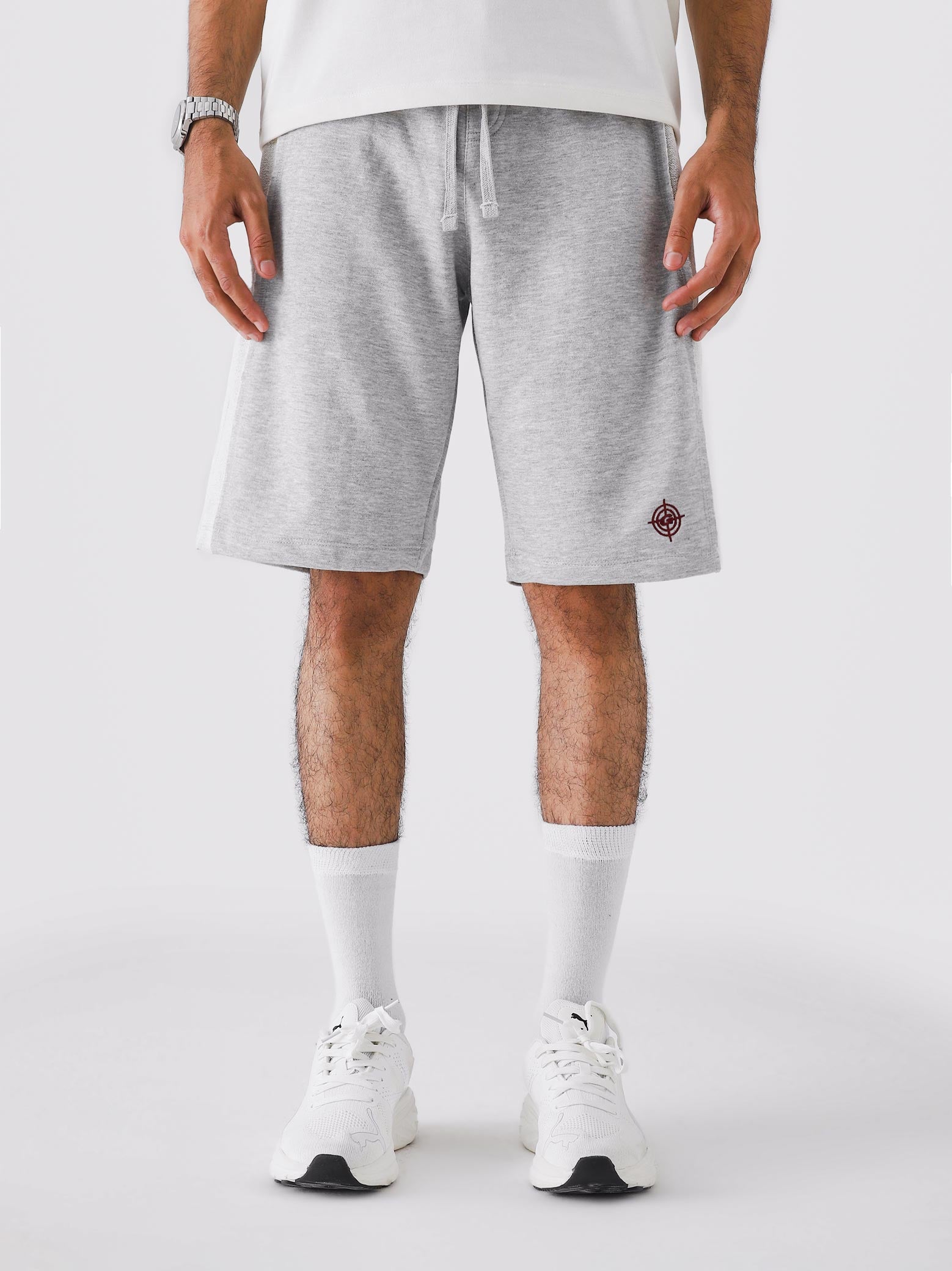 Man wearing Arctyc White Aim Shorts, GROOVY men's sport and lounge shorts, Pakistan streetwear