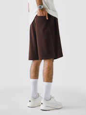 Mocha Brown Aim Shorts on model, relaxed-fit men's gym and casual shorts by GROOVY Pakistan