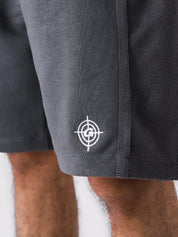 Graphite Grey Aim Shorts on model, relaxed-fit men's gym and casual shorts by GROOVY Pakistan
