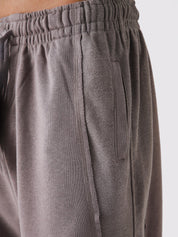 Stone Mauve Aim Shorts on model, relaxed-fit men's gym and casual shorts by GROOVY Pakistan