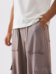 Rear flap pocket on mauve cargo trousers - GROOVY Pakistan