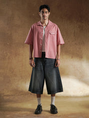 Female model wearing red gingham oversized shirt - GROOVY Pakistan