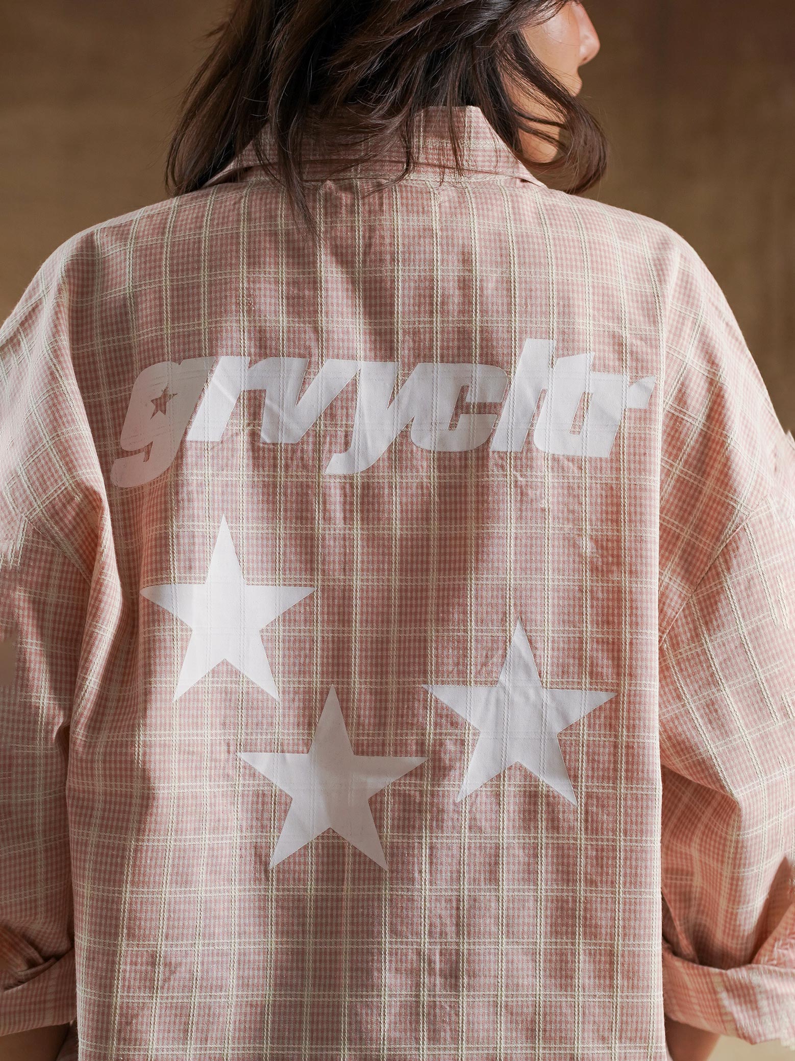 Shoulder seam and sleeve drape on plaid shirt - GROOVY Pakistan