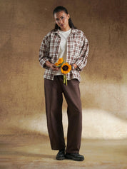 Brown plaid shirt worn open over a cream tee - GROOVY Pakistan