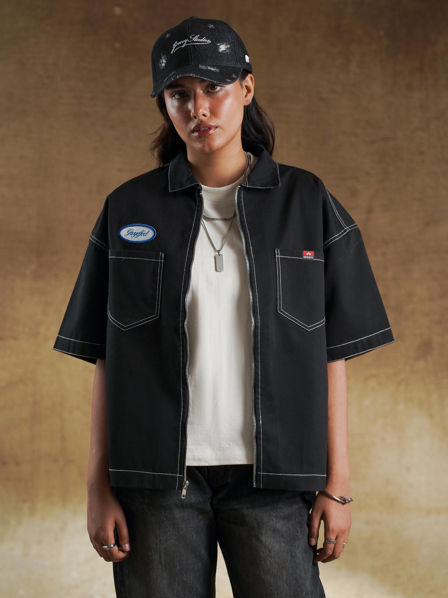 Sleeve and hem finish on black work shirt - GROOVY Pakistan