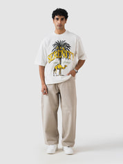 GROOVY beige oversized t-shirt, palm tree and camel graphic, Pakistan